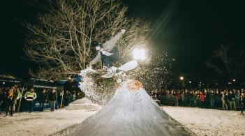 Student snowboarding off a jump