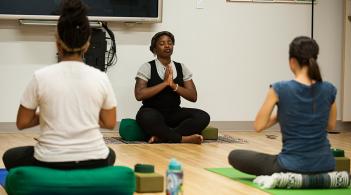 Link, group of three people practicing mindfulness