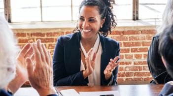 woman clapping and smiling