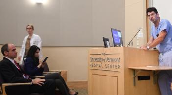 Surgeon standing at lectern