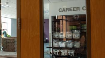 Photo of door that says Career Center and has center hours listed