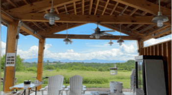 Photo from outdoor pavillion looking out at a field
