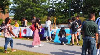 Students standing in front of the club tabling event 