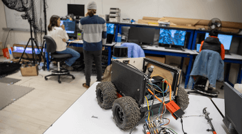 UVM students collaborate on a project in a robotics lab.