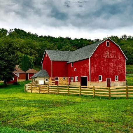 red barn and green lawn