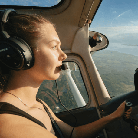 Bella in the cockpit of an aircraft
