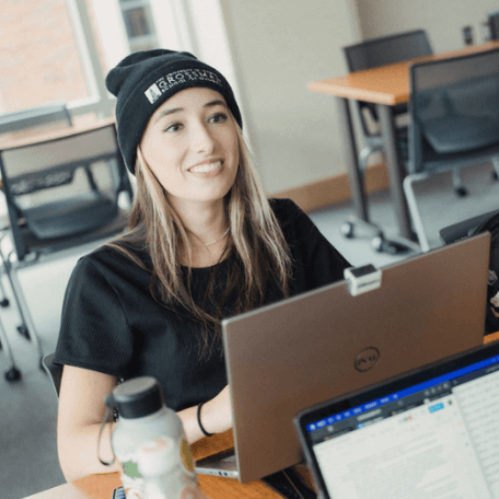 Lily works on her laptop