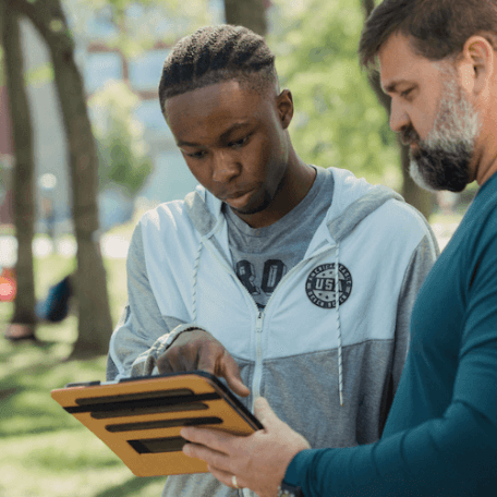 Wayne looks at an ipad