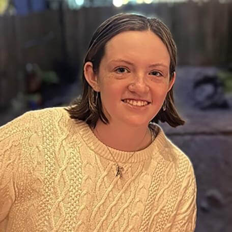 A profile image of a person with beige shirt