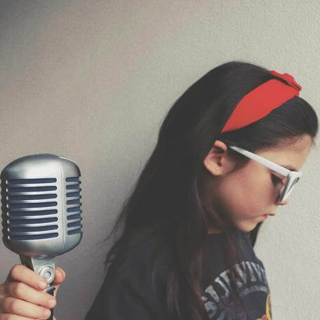 youngster with an old-fashioned microphone