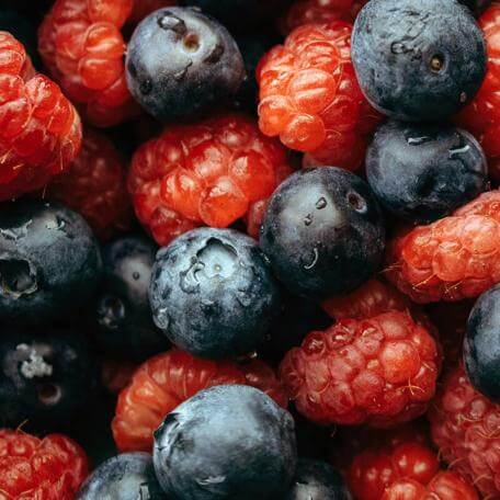 closeup of blueberries and raspberries mixed together