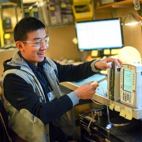 Biomedical Engineering student using analysis equipment