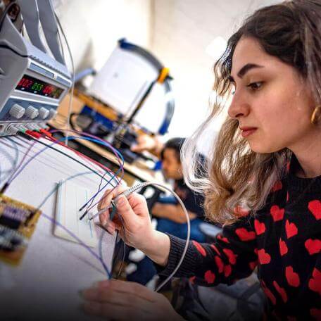EE graduate students works on drones in her lab