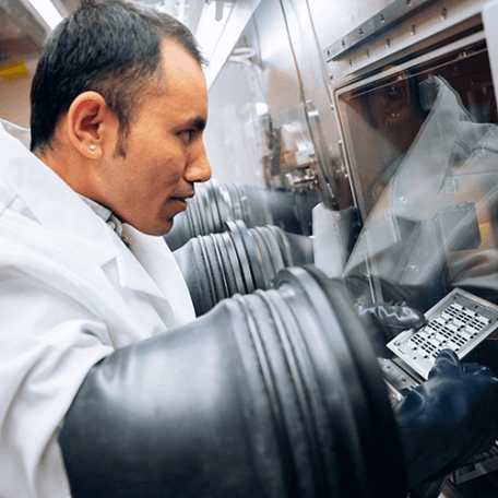 A Physics graduate student at work in the lab