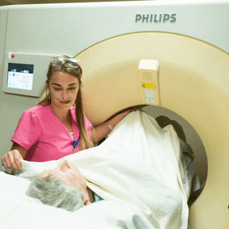 Nurse treating a patient in radiation oncology.