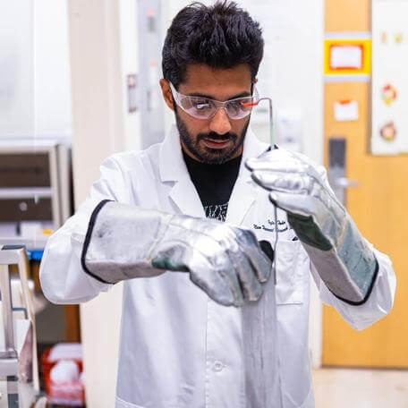 Graduate student working in a Mechanical Engineering lab