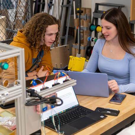 Student collaborating on lab project
