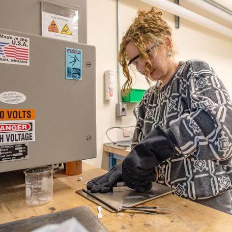 CEMS graduate student at work in the lab