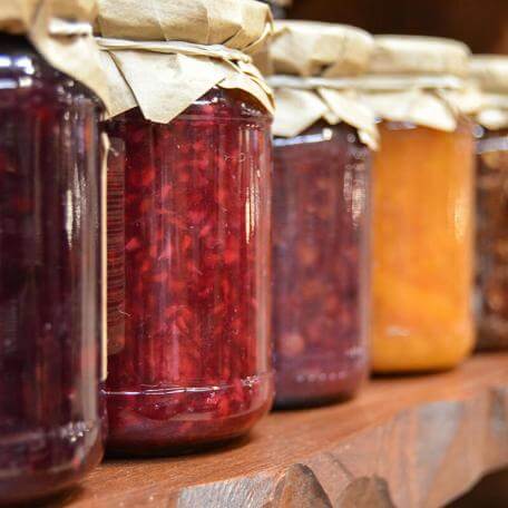 glass jars of fruit preserves