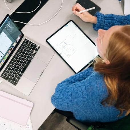 Student with a blue sweater at the computer