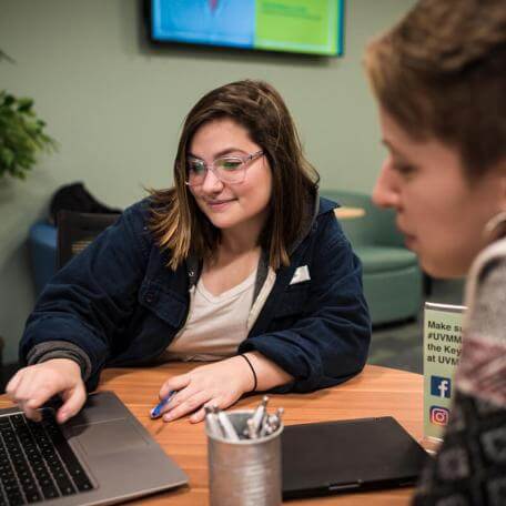 An advisor in the UVM Career Center helping a student