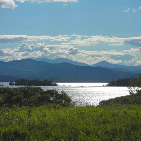 Link, wide shot of Lake Champlain with mountains in the background