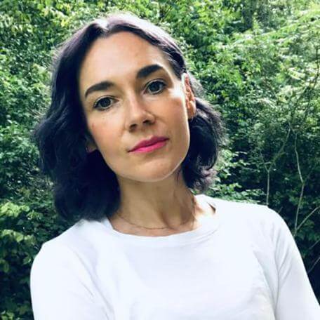 A person in white shirt posing for photo