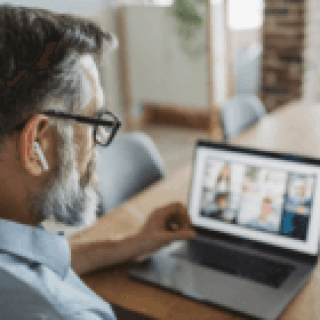 Person sitting looking at a computer screen