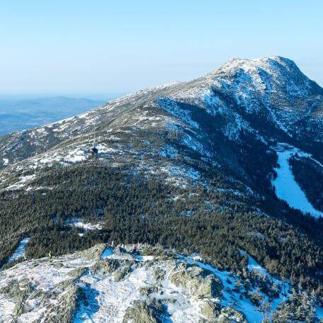 An aerial view of Mount Mansfield with snow on it, by Spatial Analysis Lab