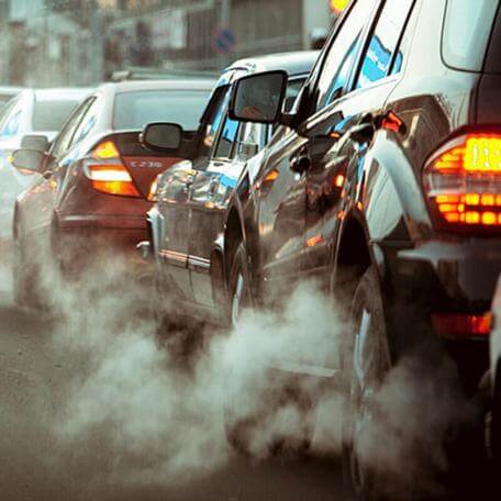 Car exhaust on urban street