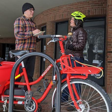 Transportation researcher interviews a cyclist