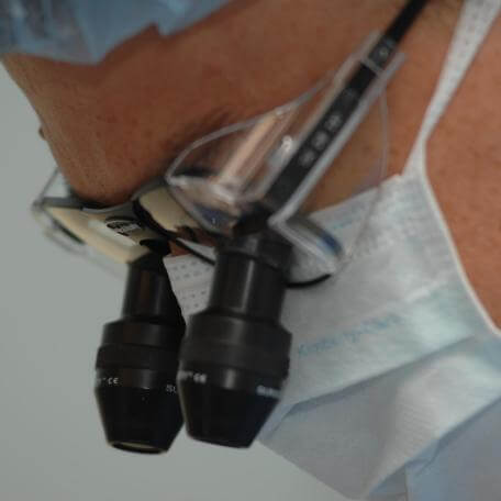 A person wearing a mask and safety glasses