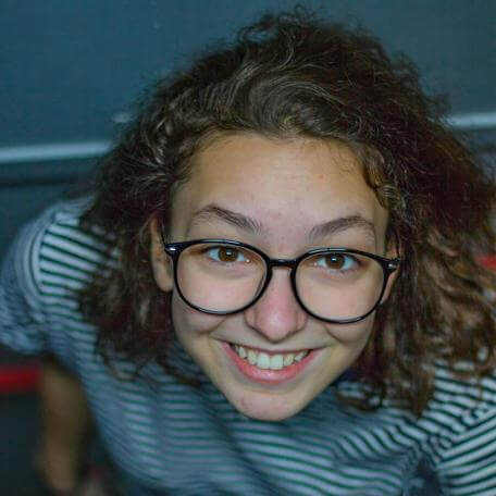 smiling student wearing glasses
