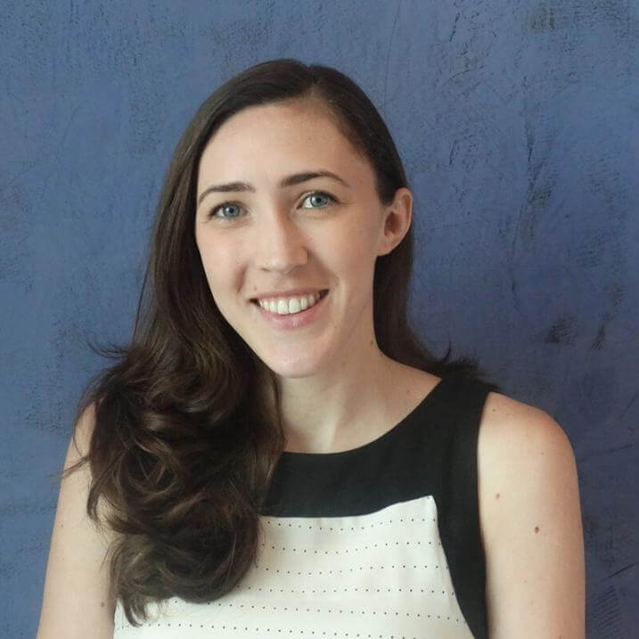 headshot of Alison smiling in an indoor setting