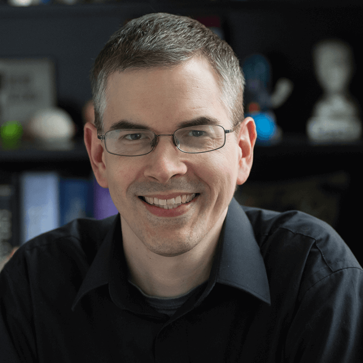 Keith, smiling for the camera in an office type setting