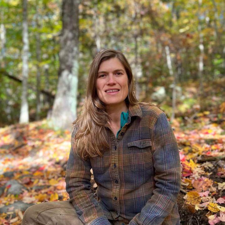 Ali sitting in the woods