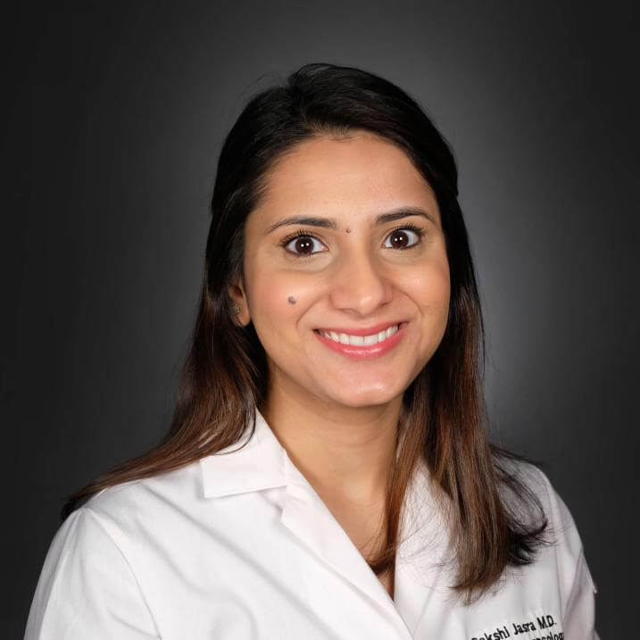 A person wearing a white coat