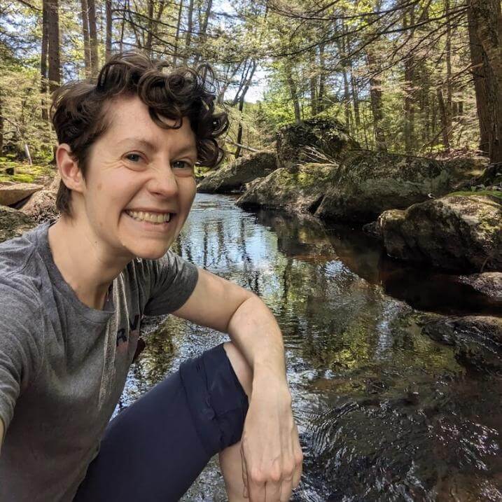 Laura by a forest stream