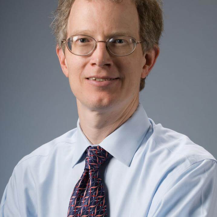 A person wearing a shirt and tie 