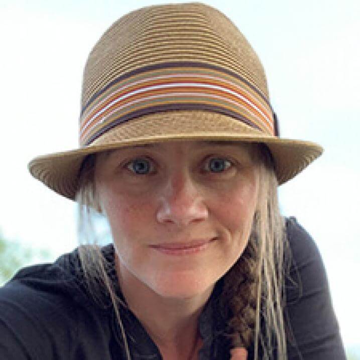 woman wearing tan hat