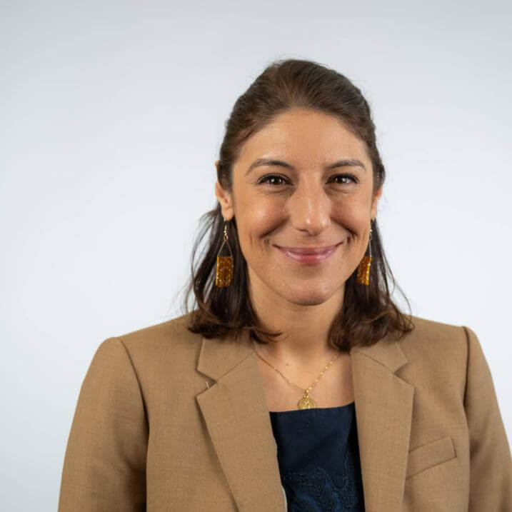 A person with brown hair and a brown blazer