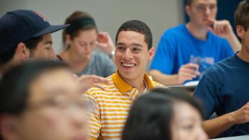 Students smile during a lecture 