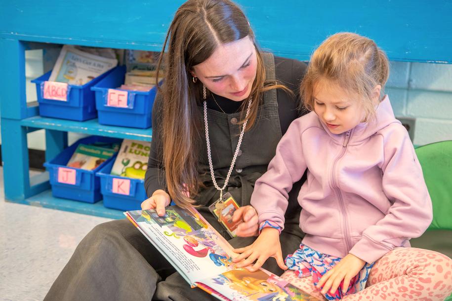 Ella McCarthy works with a student on reading.