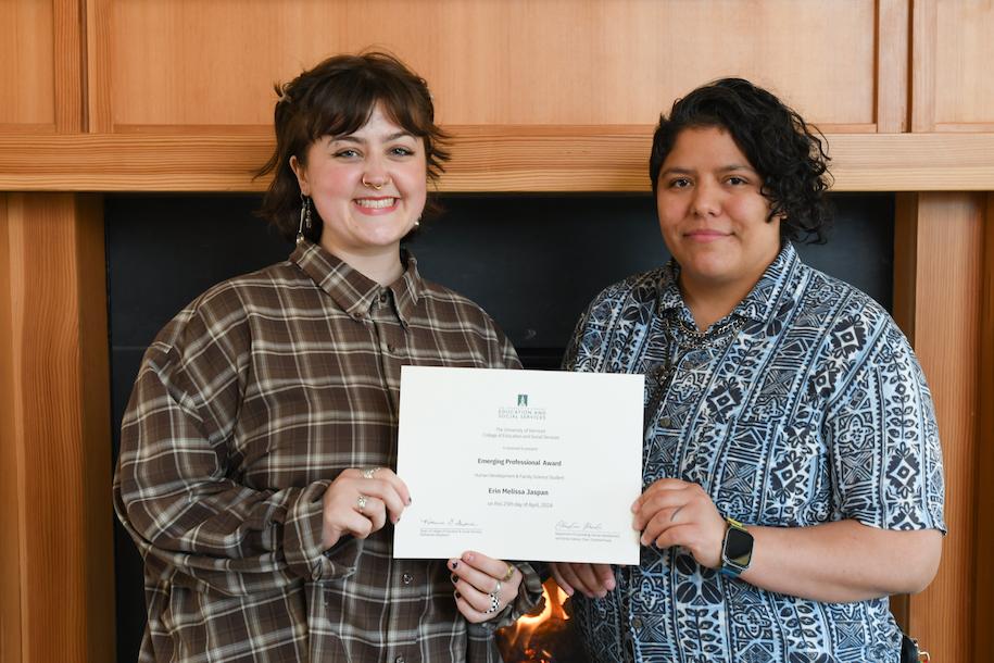 Erin Japan holding her award certificate with HDFS faculty member Jaz Routon