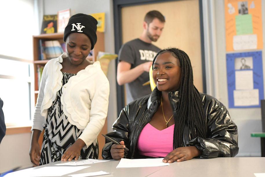 Franky Bahati working with high school students in DREAM Program group.