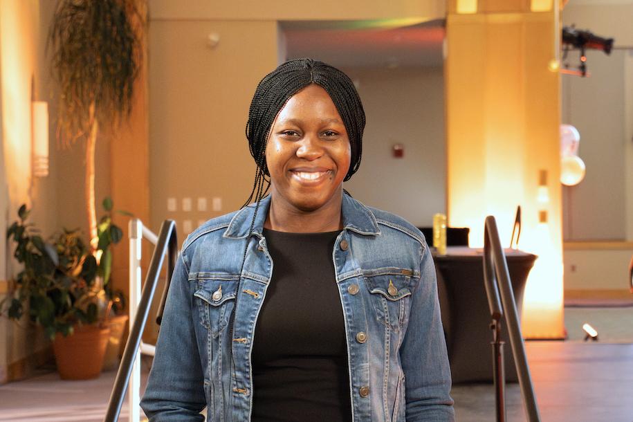 Joy Emmanuel smiling at the Mosaic Center for Students of Color Awards Reception