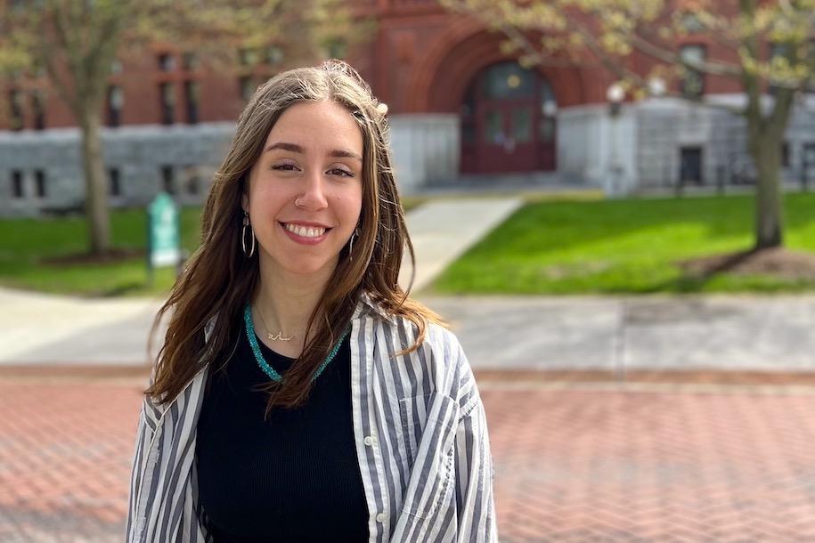 Sarah Sarrouf smiling in front of Williams Science Hall at UVM