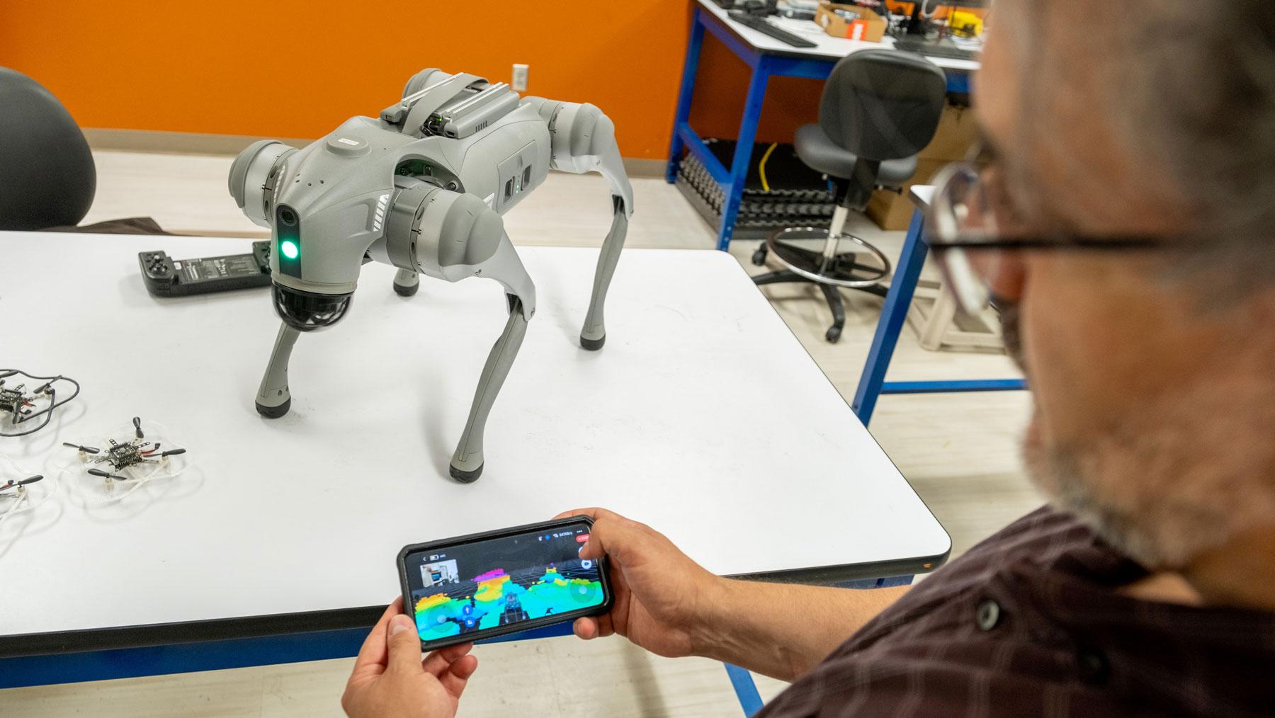 Assistant Professor Luis Duffaut demonstrates a robot's Lidar System