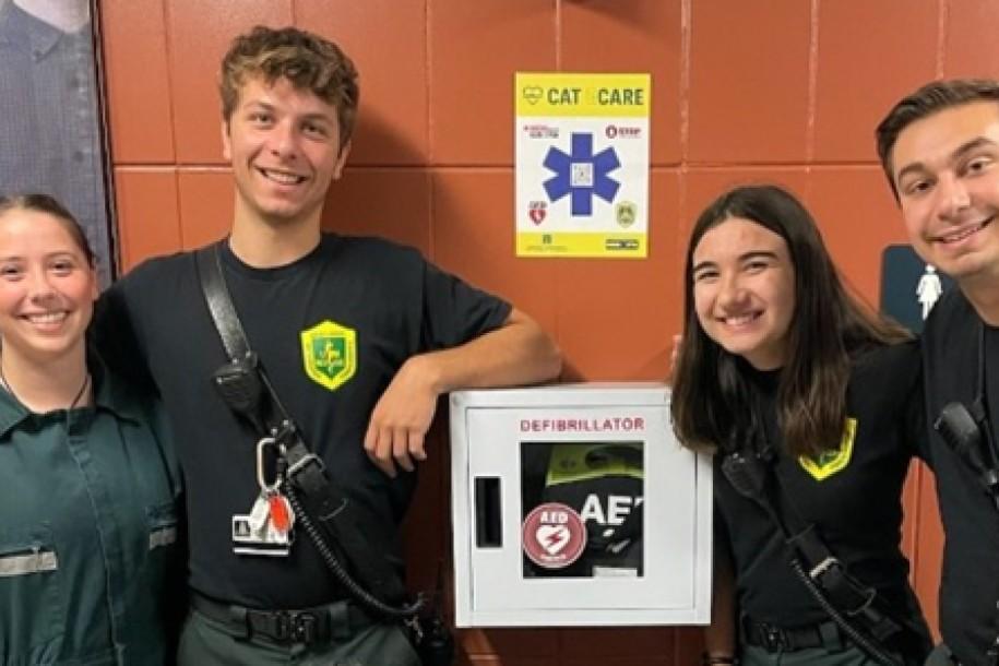 â UVM Rescue volunteers with a newly installed Cat ECare AED station. â