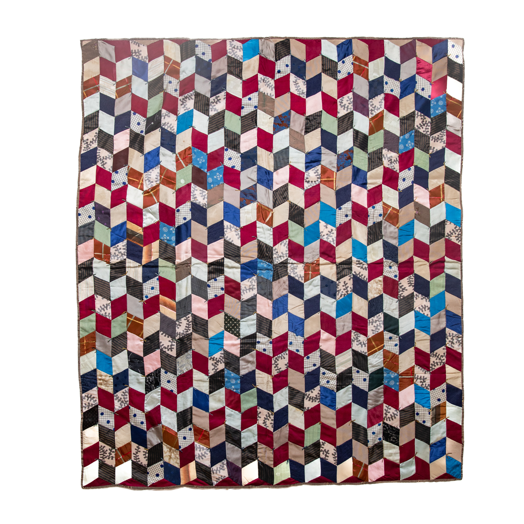 Multi-colored diamond-shaped fabrics make up this stunning quilt.